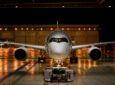 Airbus A350 outside of a hangar at night
