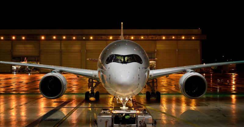 Airbus A350 outside of a hangar at night